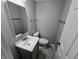 The bathroom has a sleek vanity with a stone countertop and dark wood cabinets at 10063 Penrith Dr, Indianapolis, IN 46229