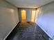 A spacious primary bedroom is carpeted and leads to a large closet and ensuite bathroom at 10063 Penrith Dr, Indianapolis, IN 46229