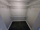 A closet with metal rack shelving and dark gray carpet sits ready to organize all your garments at 10063 Penrith Dr, Indianapolis, IN 46229