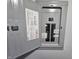 Electrical panel box with labeled circuits for kitchen, living room, and bathroom at 10063 Penrith Dr, Indianapolis, IN 46229