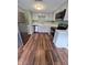 Modern kitchen with stainless steel appliances, stylish countertops, and sleek gray cabinetry at 10063 Penrith Dr, Indianapolis, IN 46229