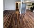 Spacious living area with wood floors, neutral paint, and a view of the kitchen and hallway at 10063 Penrith Dr, Indianapolis, IN 46229