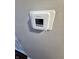 Honeywell Home thermostat installed on a gray wall for controlling the home temperature at 10063 Penrith Dr, Indianapolis, IN 46229