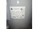 Close up of the electric water heater information tag with manufacturer and model details at 10063 Penrith Dr, Indianapolis, IN 46229