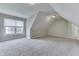 Finished attic space with carpet and a window offering natural light at 1014 Massey Ct, Greenwood, IN 46143
