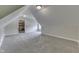 Large finished attic space with carpet, dormer window, and neutral paint at 1014 Massey Ct, Greenwood, IN 46143