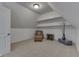 Finished attic with carpet, neutral paint, and tastefully selected furniture and decorations at 1014 Massey Ct, Greenwood, IN 46143
