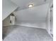 Finished attic space leading into another room, both with carpeted floors at 1014 Massey Ct, Greenwood, IN 46143