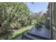 View of backyard patio and landscaping with mature trees and manicured lawn at 1014 Massey Ct, Greenwood, IN 46143