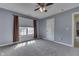 Comfortable bedroom with carpet, ceiling fan, and a large window offering natural light at 1014 Massey Ct, Greenwood, IN 46143