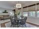 Bright dining area features a stone fireplace, hardwood floors, and large windows for natural light at 1014 Massey Ct, Greenwood, IN 46143