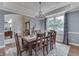 Inviting dining area showcasing a rustic wooden table, seating for eight, and a lovely light fixture at 1014 Massey Ct, Greenwood, IN 46143
