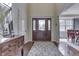 Welcoming foyer featuring a hardwood floor, stylish rug, and a gracefully crafted wooden front door at 1014 Massey Ct, Greenwood, IN 46143