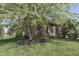 A tranquil property showing a side exterior, and mature trees on a well-kept lawn at 1014 Massey Ct, Greenwood, IN 46143