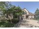 Charming brick home with a three-car garage and lush landscaping, set against a clear blue sky at 1014 Massey Ct, Greenwood, IN 46143