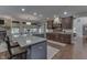 Spacious kitchen with granite countertops, island seating, and hardwood floors at 1014 Massey Ct, Greenwood, IN 46143
