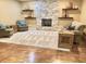 Cozy living room with a stone fireplace, plush seating, and warm beige walls at 1014 Massey Ct, Greenwood, IN 46143