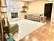 Inviting living room features a stone fireplace, neutral carpet and comfortable seating at 1014 Massey Ct, Greenwood, IN 46143