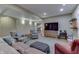 Spacious living area features comfortable seating, natural light, and entertainment center with TV at 1014 Massey Ct, Greenwood, IN 46143