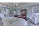 Bright main bedroom with ample closet space, comfortable seating, and access to outdoor patio at 1014 Massey Ct, Greenwood, IN 46143