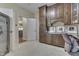 Well-lit office with custom cabinets, built-in shelves, and a door to the kitchen at 1014 Massey Ct, Greenwood, IN 46143