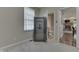 Well-lit room with a large safe, neutral carpet, and access to a bathroom at 1014 Massey Ct, Greenwood, IN 46143