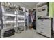 This walk-in closet has custom shelving and plenty of storage space for clothing and accessories at 1014 Massey Ct, Greenwood, IN 46143