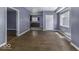 Spacious living room with hardwood floors, neutral paint, natural light, and an open floor plan at 1049 N Tremont N St, Indianapolis, IN 46222
