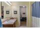 Bathroom with single sink vanity and access to the walk in closet at 10625 Gathering Dr, Indianapolis, IN 46259
