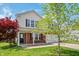 Charming two-story home with vinyl siding, brick accents, a well-maintained lawn and mature landscaping at 10625 Gathering Dr, Indianapolis, IN 46259