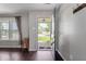 Inviting foyer with dark wood flooring, neutral walls, and a clear view to the outside, and coat hooks at 10625 Gathering Dr, Indianapolis, IN 46259