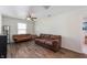 Cozy living room with wood laminate flooring and a ceiling fan at 10625 Gathering Dr, Indianapolis, IN 46259