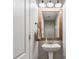 This powder room features a modern sink and a framed mirror with an industrial vibe at 10625 Gathering Dr, Indianapolis, IN 46259