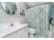 Bathroom features a vanity, framed art, and shower with patterned curtain at 11108 Oakridge Dr, Fishers, IN 46038
