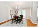 Cozy dining room with a wooden table, decorative lighting, and access to the screened in porch at 11108 Oakridge Dr, Fishers, IN 46038