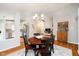 Charming dining room with hardwood floors, stylish lighting, and easy access to the kitchen and living areas at 11108 Oakridge Dr, Fishers, IN 46038