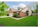 Attractive brick house with a manicured lawn, attached garage, and inviting front entrance at 11108 Oakridge Dr, Fishers, IN 46038