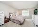 Comfortable main bedroom featuring a neutral color palette and soft carpet at 11108 Oakridge Dr, Fishers, IN 46038
