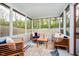 Comfortable screened porch with outdoor seating and a view of the backyard at 11108 Oakridge Dr, Fishers, IN 46038