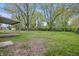 Lush backyard featuring mature trees and ample space for outdoor activities at 1116 Heatherwood Dr, Indianapolis, IN 46241