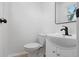 Chic bathroom featuring a vanity, dark faucet, and natural lighting at 1116 Heatherwood Dr, Indianapolis, IN 46241