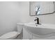 Modern bathroom featuring updated vanity, sleek fixtures, and neutral finishes at 1116 Heatherwood Dr, Indianapolis, IN 46241