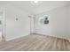 A sunlit bedroom features wood-look floors, a window, and a closet at 1116 Heatherwood Dr, Indianapolis, IN 46241