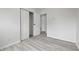 A bright bedroom with closet and hardwood style flooring at 1116 Heatherwood Dr, Indianapolis, IN 46241