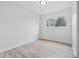 Bright and airy bedroom with hardwood flooring and ample natural light at 1116 Heatherwood Dr, Indianapolis, IN 46241