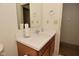 Bright bathroom with a wooden vanity and mirror at 11541 Coastal Dr, Indianapolis, IN 46229