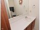 Bathroom with single sink, vanity, and toilet in a well-lit space at 11541 Coastal Dr, Indianapolis, IN 46229