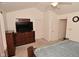 Bedroom with a wooden dresser, neutral carpet, and multiple doors, providing comfort and convenience at 11541 Coastal Dr, Indianapolis, IN 46229