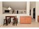 Eat-in dining area with a counter top pass through to living room, table and 4 chairs at 11541 Coastal Dr, Indianapolis, IN 46229