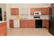 Bright kitchen with appliances, ample cabinet space, and tile floor at 11541 Coastal Dr, Indianapolis, IN 46229